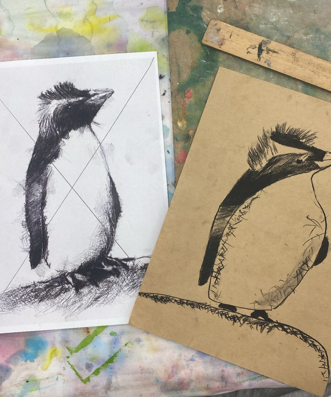 Workshop materials and art pieces created by children during a drawing and painting workshop.