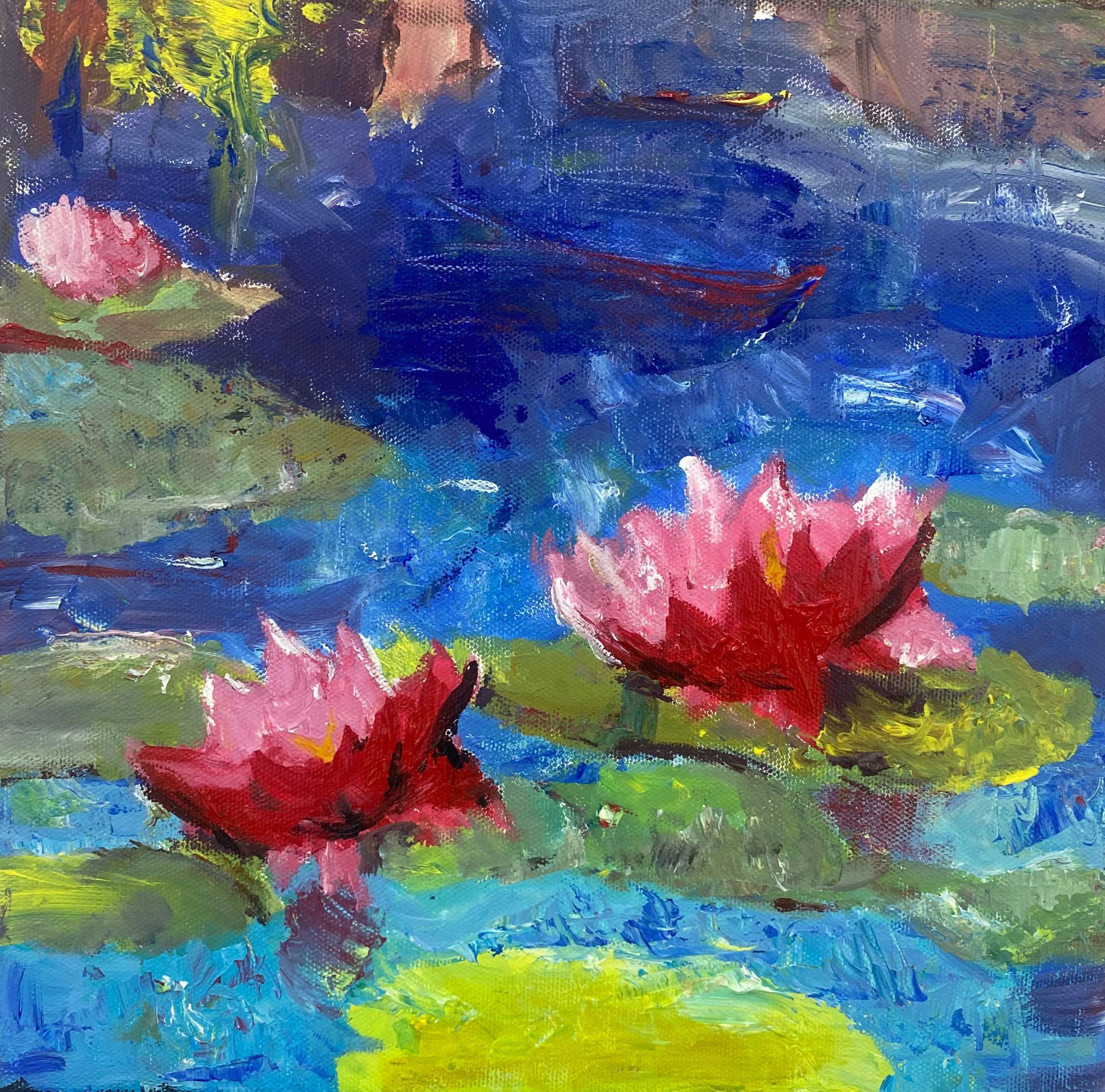 Painting of water lilies on a canvas with an easel